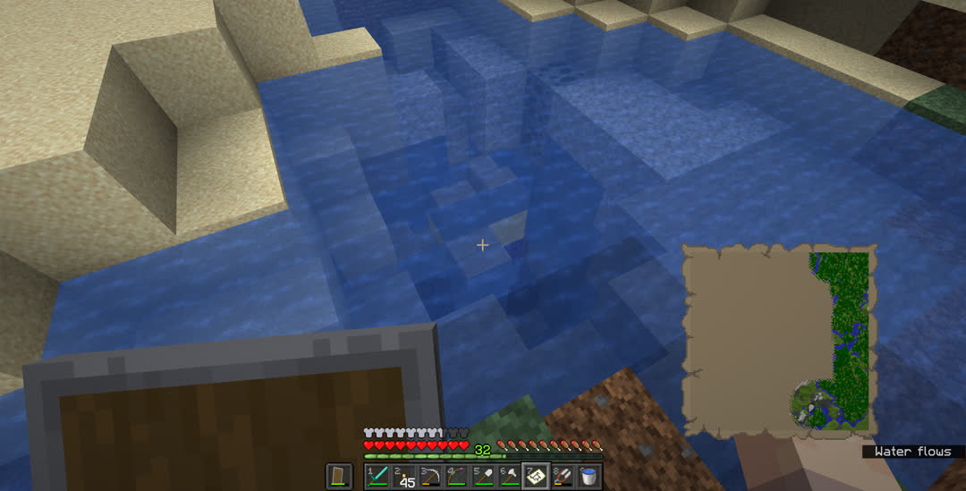 Looking down into a pond. There’s a ruined nether portal below the surface.