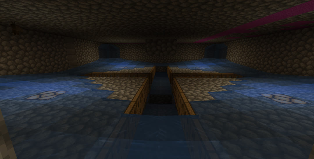 The same view of the spawning chamber as earlier, except now water is flowing down from the corners of the room. It spreads across each quarter, covering most of the platform except for the corner closest to the center of the room.
