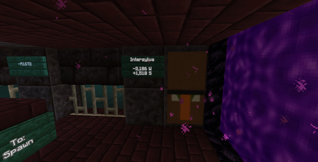 The Intersylva end of the line. Next to a nether portal is a banner of a villager’s face and a sign reading “Intersylva, −2,186 W, +1,518 S”. Signs at the end of the tracks read “To: Spawn” and “−A1672”.