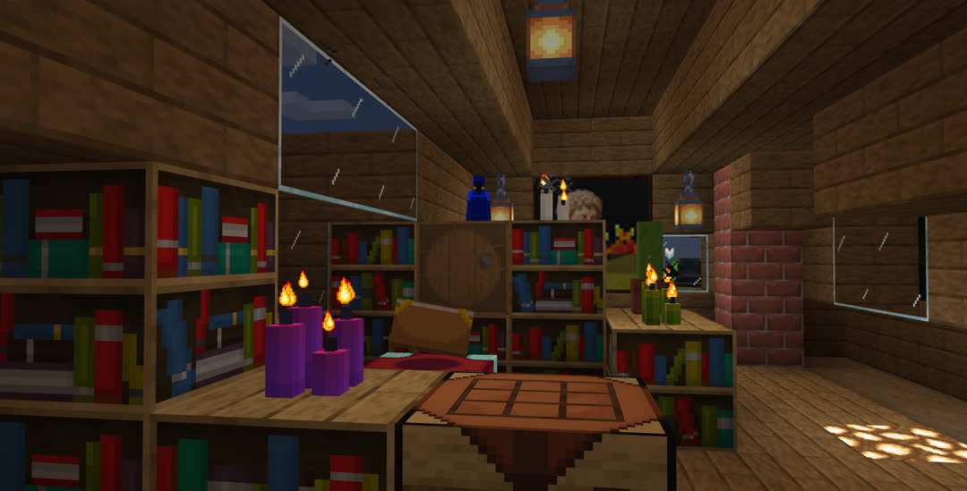 Evening view of the enchanting area upstairs. A few patches of candles in purple, white, and green rest on the bookshelves.