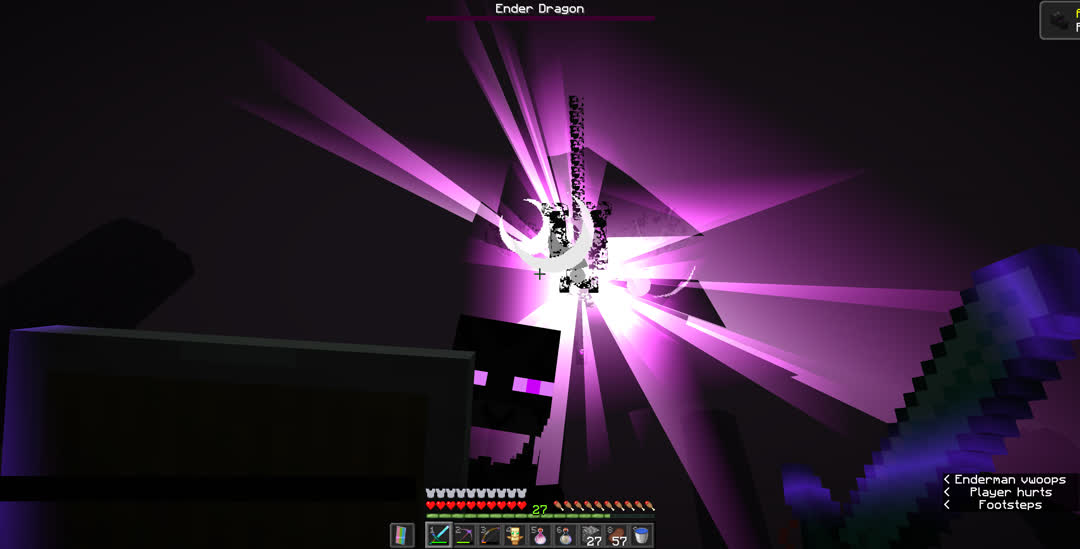 Looking up at the decaying ender dragon ascending into the sky as she releases rays of light. The “Free the End” advancement toast is just disappearing from the screen with only its icon still visible. And an angered enderman is looking directly at me.