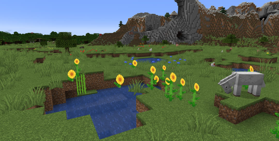 A small pond surrounded by sunflowers. Several sunflowers have generated above the water, not only floating in midair, but infact with their lower halves missing entirely.