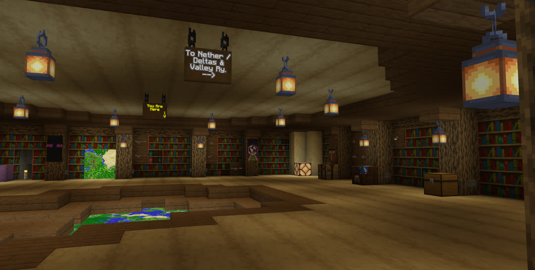 Just inside the entrance of the World Atlas, the titular map visible recessed into the center of the floor. One sign hanging from the ceiling reads “To Nether / Deltas & Valley Ry. →”; another at the center of the room reads “You Are Here ↓”, the arrow along the right edge. Most of the walls consist of bookshelves, a few of which are now chiseled bookshelves about half‐full.